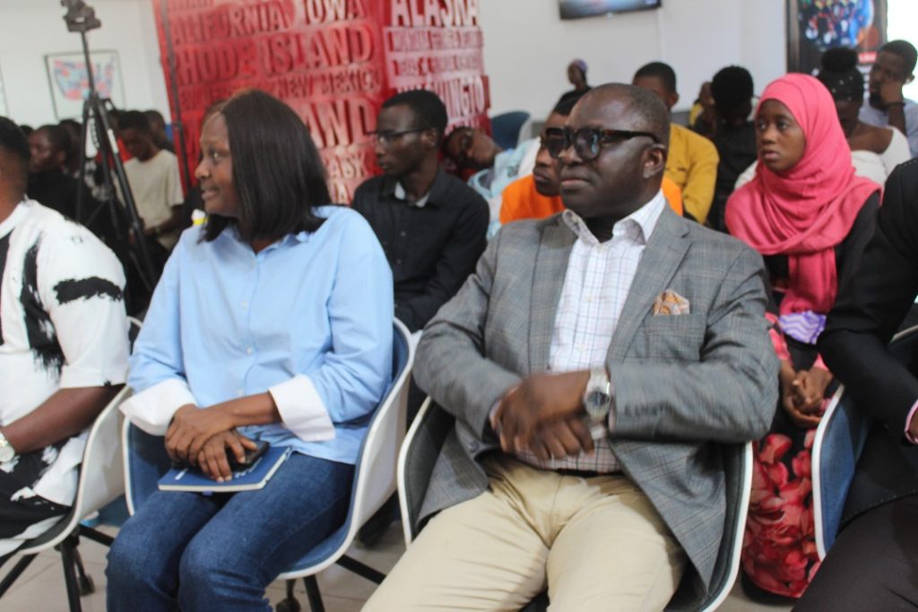 Guests and participants behind them at the AI Revolution Students Program Bootcamp graduation ceremony