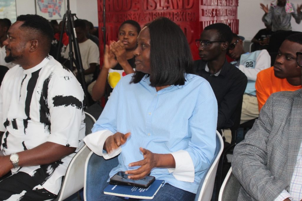 Guests at the AI Revolution Students Program Bootcamp graduation ceremony and participants behind them